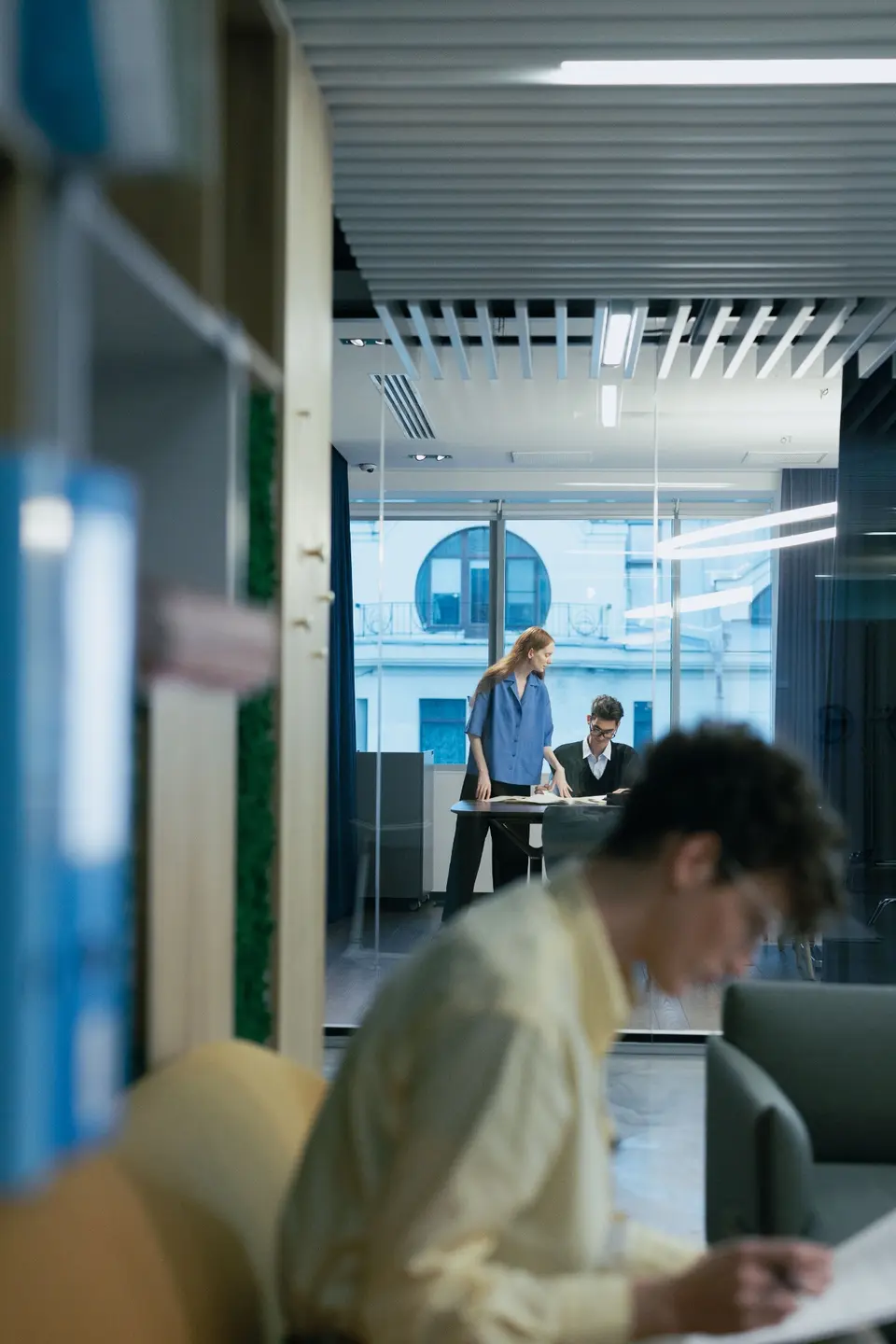 Colleagues reviewing work together in an office